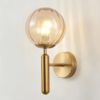 A selection of contemporary wall lights including Scandinavian, gold, and glass designs