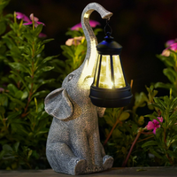 Variety of garden solar stake lights and solar garden string lights illuminating an outdoor area