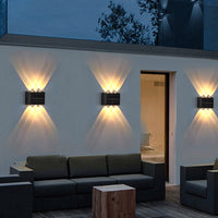 A bright solar wall light illuminating an outdoor area, ideal for garden solar lighting