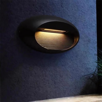 Outdoor wall light illuminating a modern patio