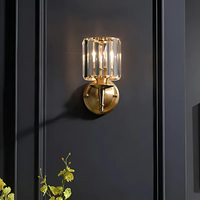 Elegant crystal wall lamp with brass embellishments for living room decor