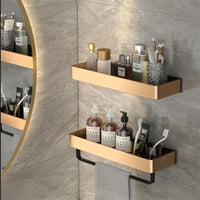 Black wall mounted bathroom shelf with corner installation in a shower.
