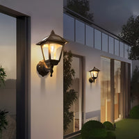 Solar wall light illuminating garden space