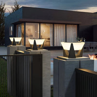 Collection of outdoor solar lights and solar powered garden lights in a yard