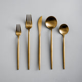 stainless steel cutlery set with gold accents