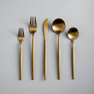 stainless steel cutlery set with gold accents