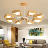 A stylish wood chandelier with a modern sputnik design illuminating a room