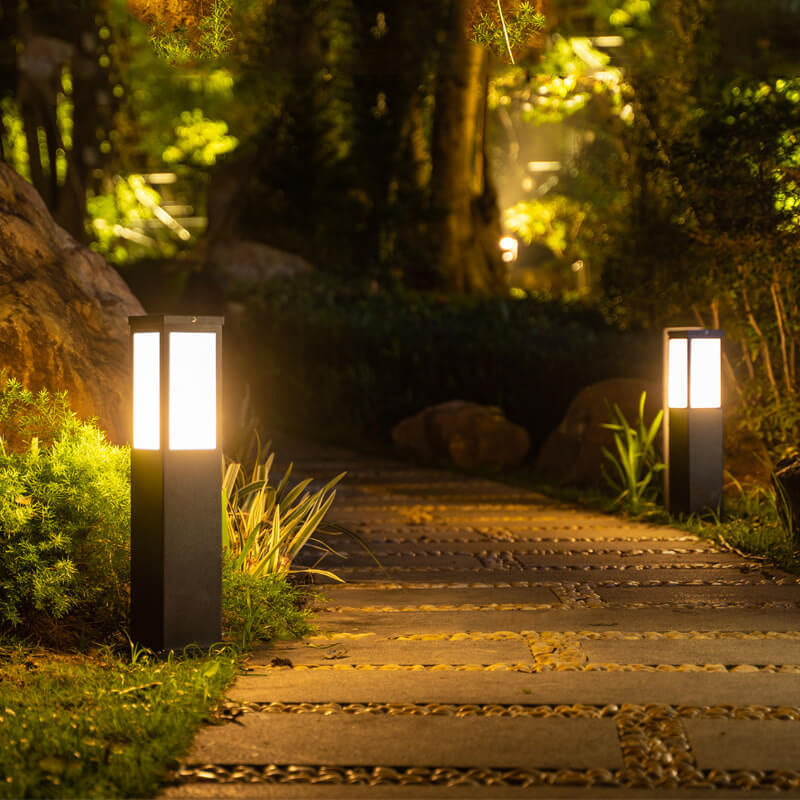 Outdoor lighting and garden lighting setup with landscape light and bollard light on patio
