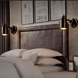Industrial wall light with adjustable arm, featuring a modern black design for indoor use