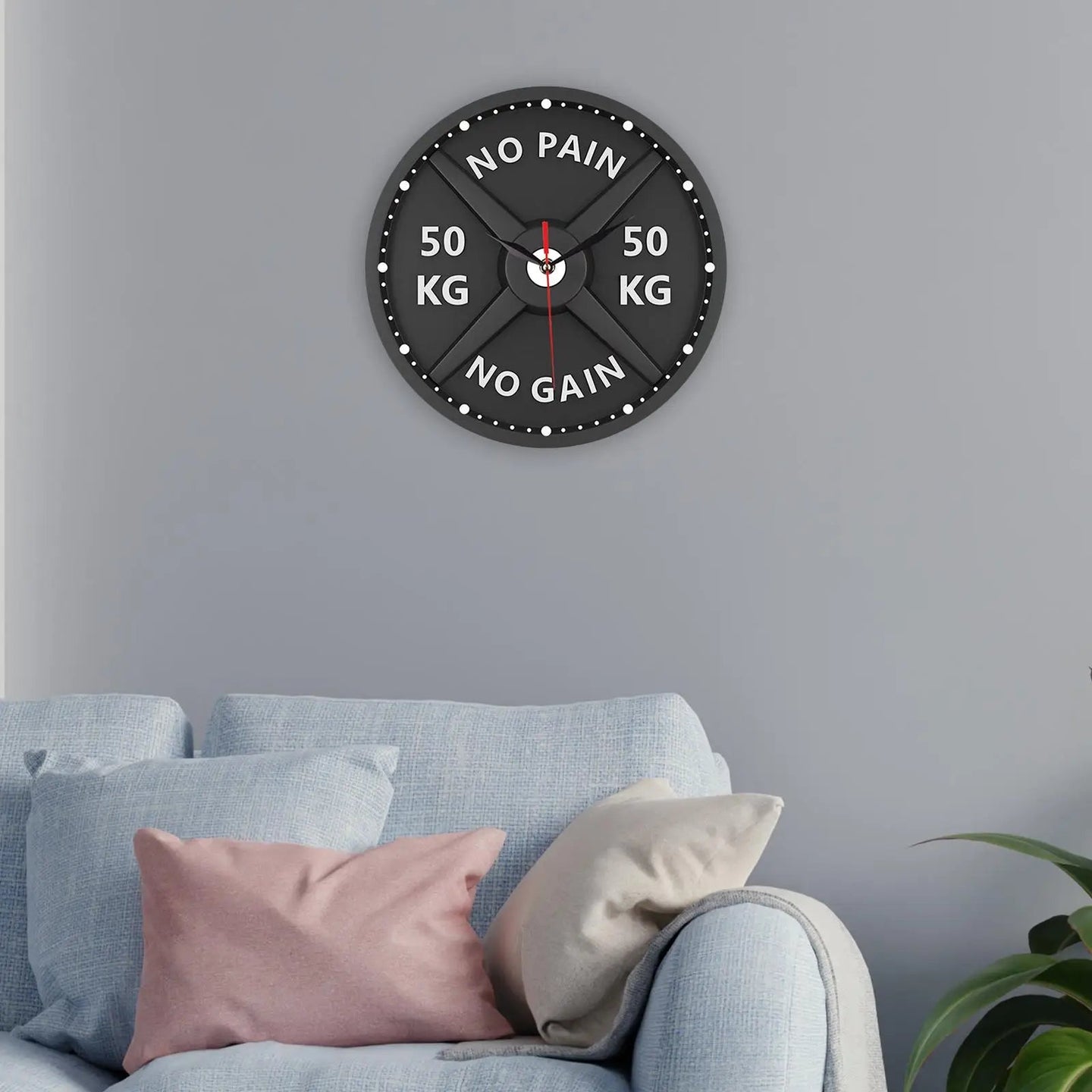 large black modern wall clock hanging on a wall