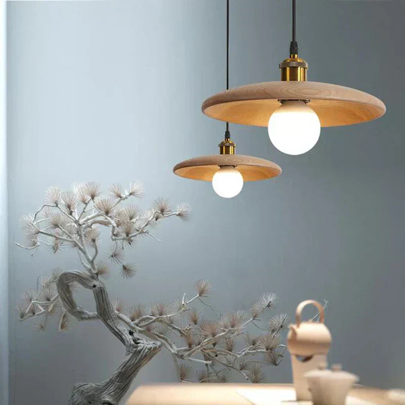 Wooden pendant light illuminating a kitchen island