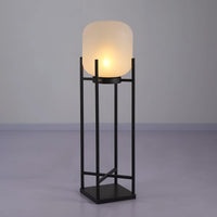 Modern outdoor solar lantern illuminating a garden pathway