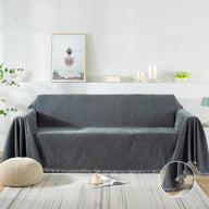 A variety of sofa throw covers and velvet couch cover displayed on a sofa