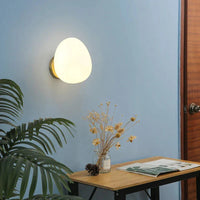 A stylish decorative wall lamp adding elegance to a modern living room wall setting