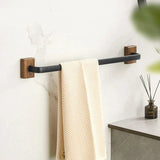 Black wall mounted towel holder in a modern bathroom