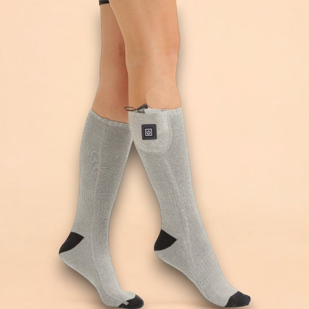 A pair of heated socks designed for both men and women providing warmth and comfort in winter