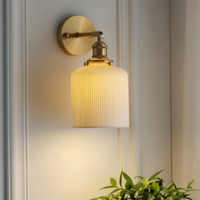 Modern ceramic wall light sconce providing LED lighting