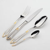 A 24 piece gold and stainless steel cutlery set arranged neatly