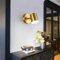 A contemporary black LED wall light installed indoors