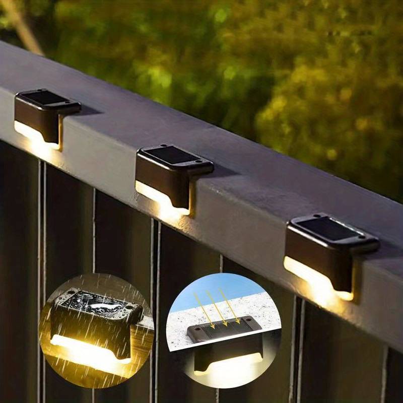 Various solar wall lights on an outdoor garden wall