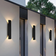 Black modern wall light suitable for outdoor use