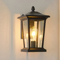 Outdoor wall lamp installed in a garden providing light