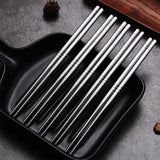 A pair of metal chopsticks with a sleek design