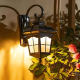 Black LED modern outdoor wall light mounted on an exterior wall