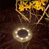 Solar garden light illuminating a pathway