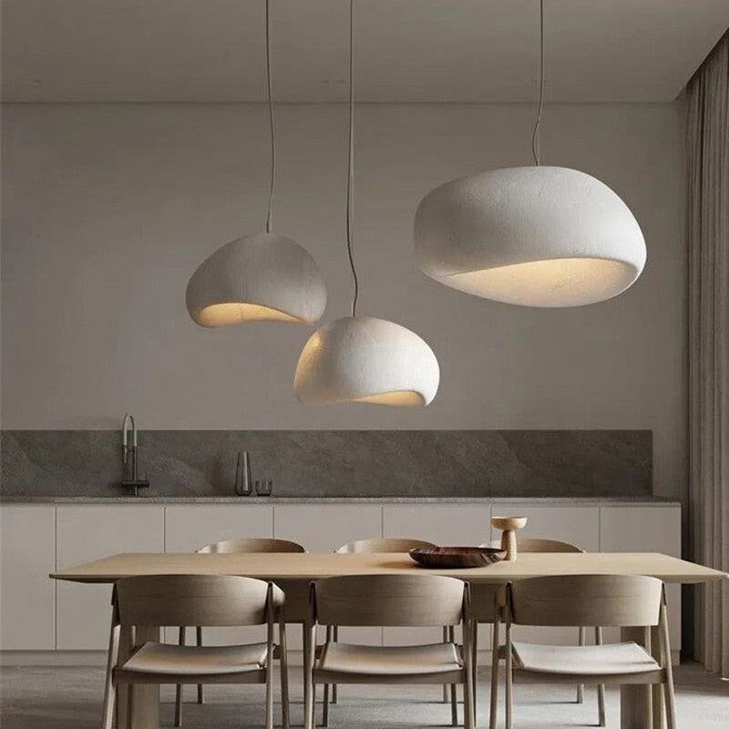 A modern pendant light and bubble ceiling light setup in a home interior.