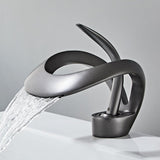 sleek black bathroom basin taps with waterfall feature