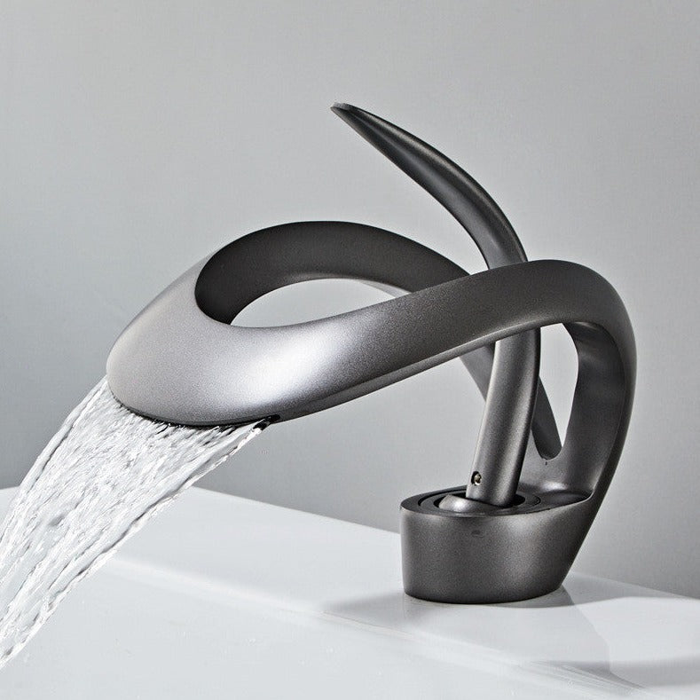 sleek black bathroom basin taps with waterfall feature
