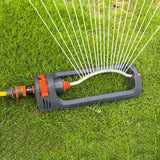 A versatile garden sprinkler system on a lush lawn